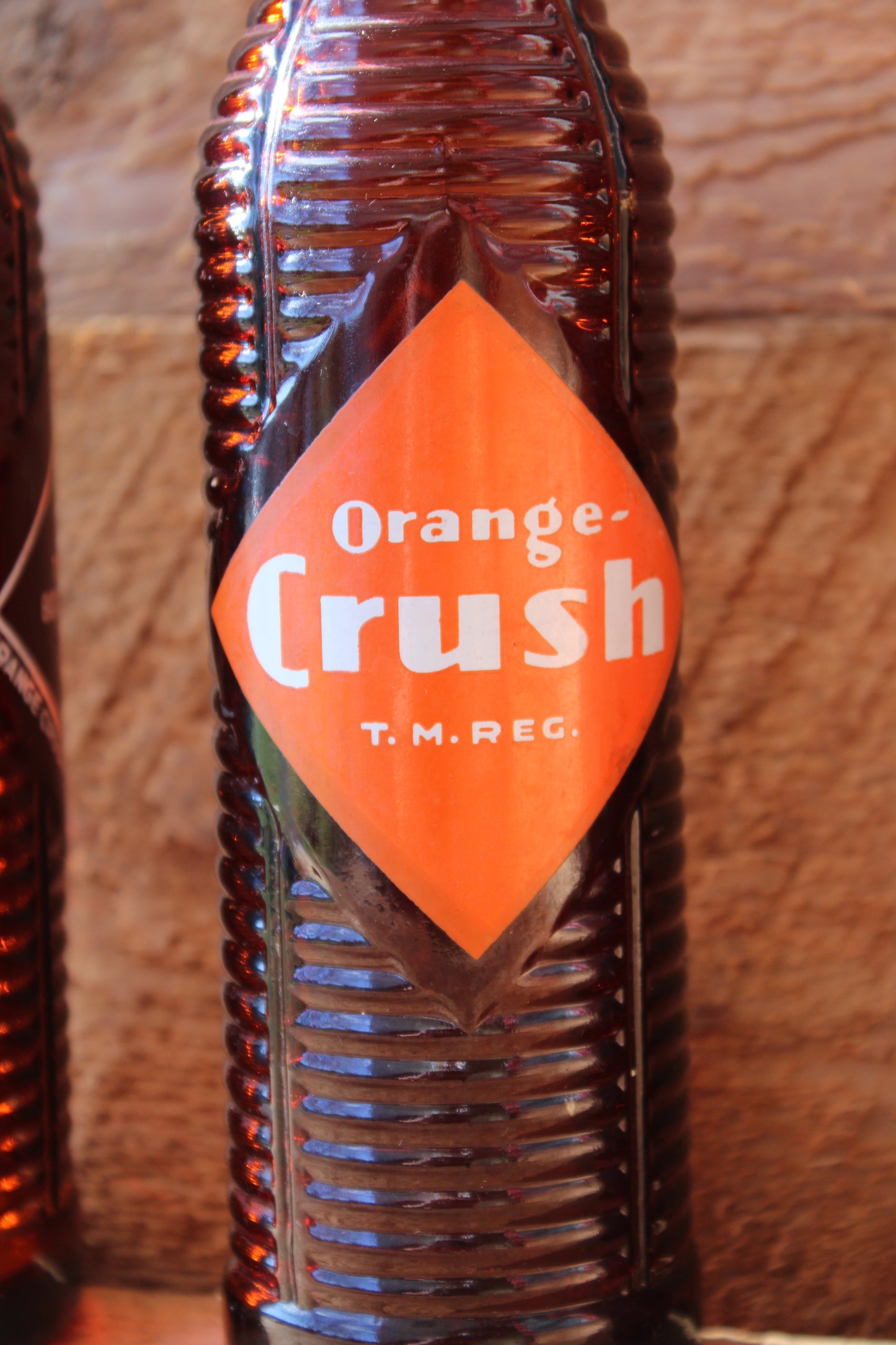 Circa 1940s Orange Crush ~ Crushy mascot ~ Lot of four ~ Brown Soda bottles