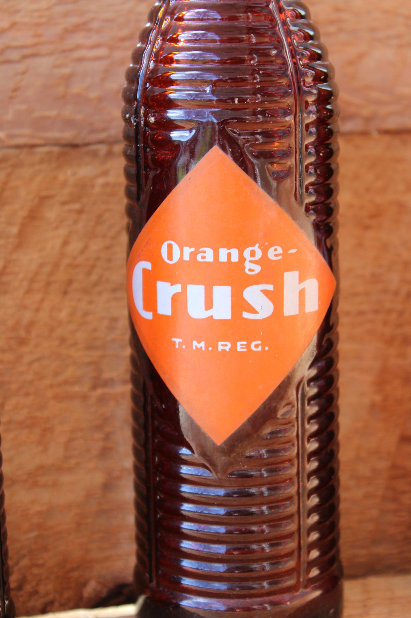 Circa 1940s Orange Crush ~ Crushy mascot ~ Lot of four ~ Brown Soda bottles