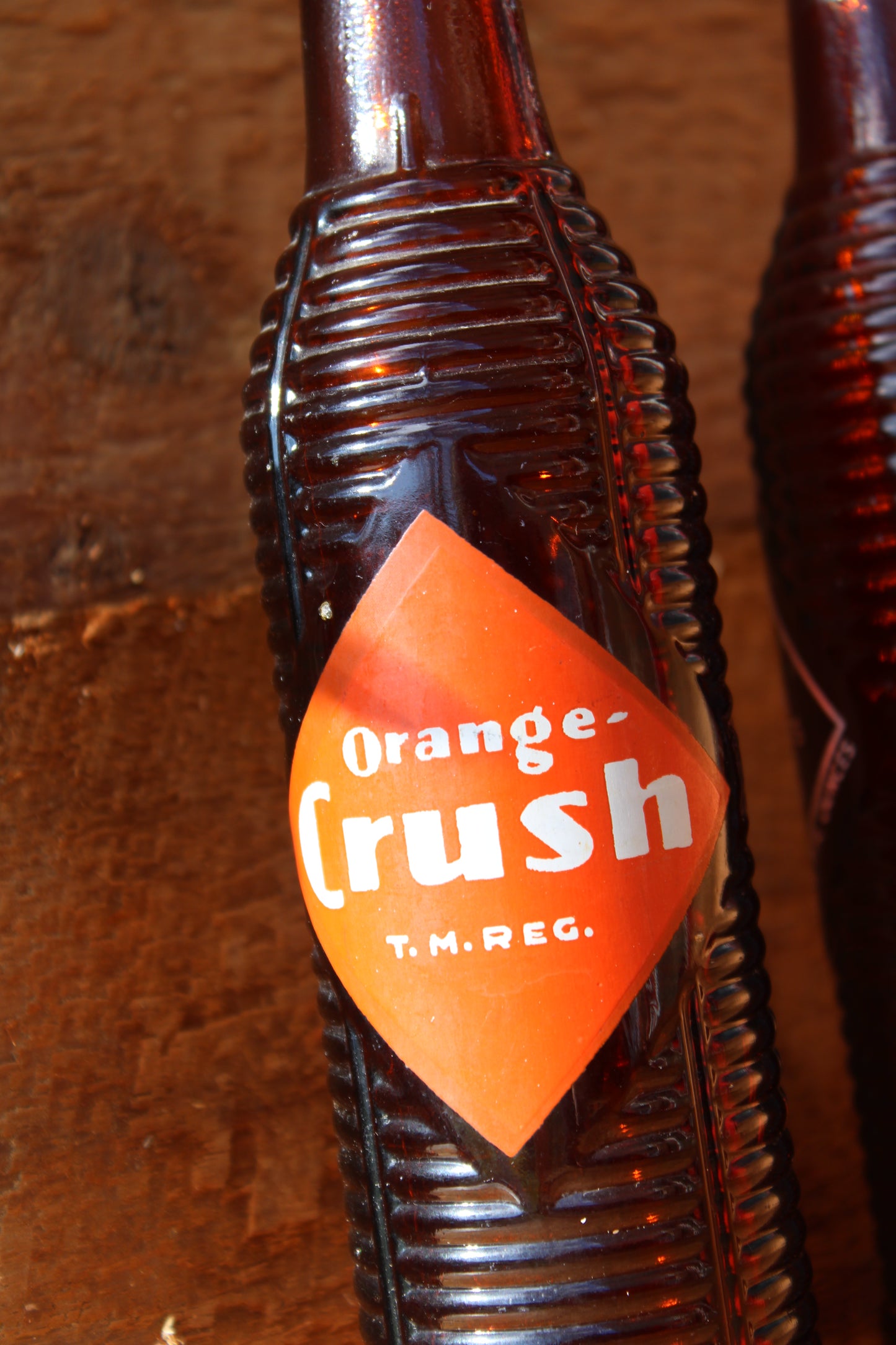 Circa 1940s Orange Crush ~ Crushy mascot ~ Lot of four ~ Brown Soda bottles