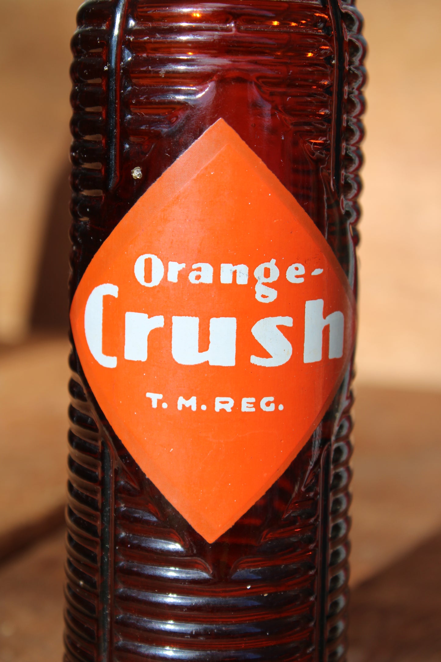 Circa 1940s Orange Crush ~ Crushy mascot ~ Lot of four ~ Brown Soda bottles